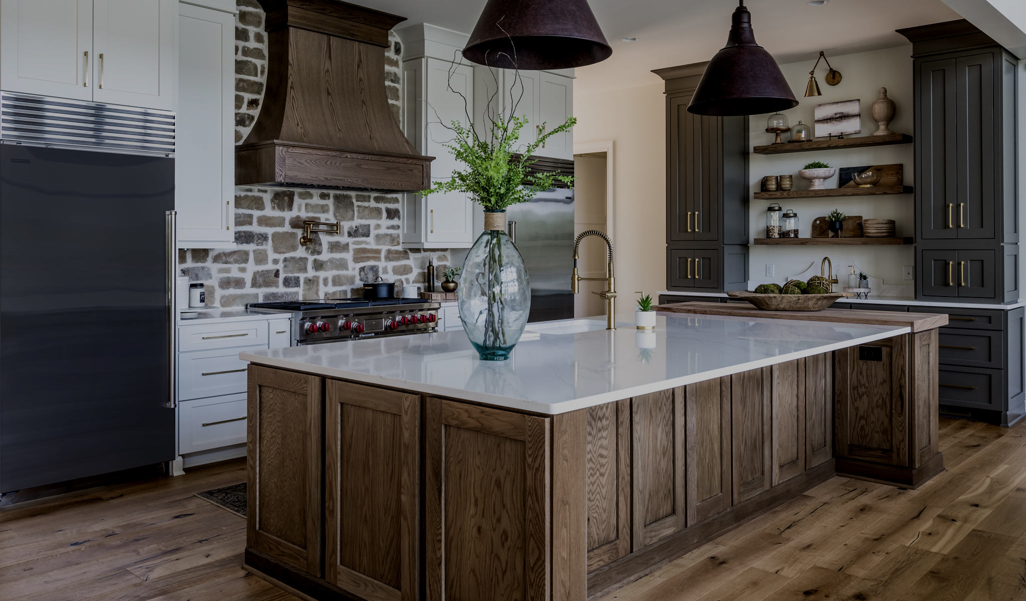Kitchen range wall with a custom hood and tiled backsplash