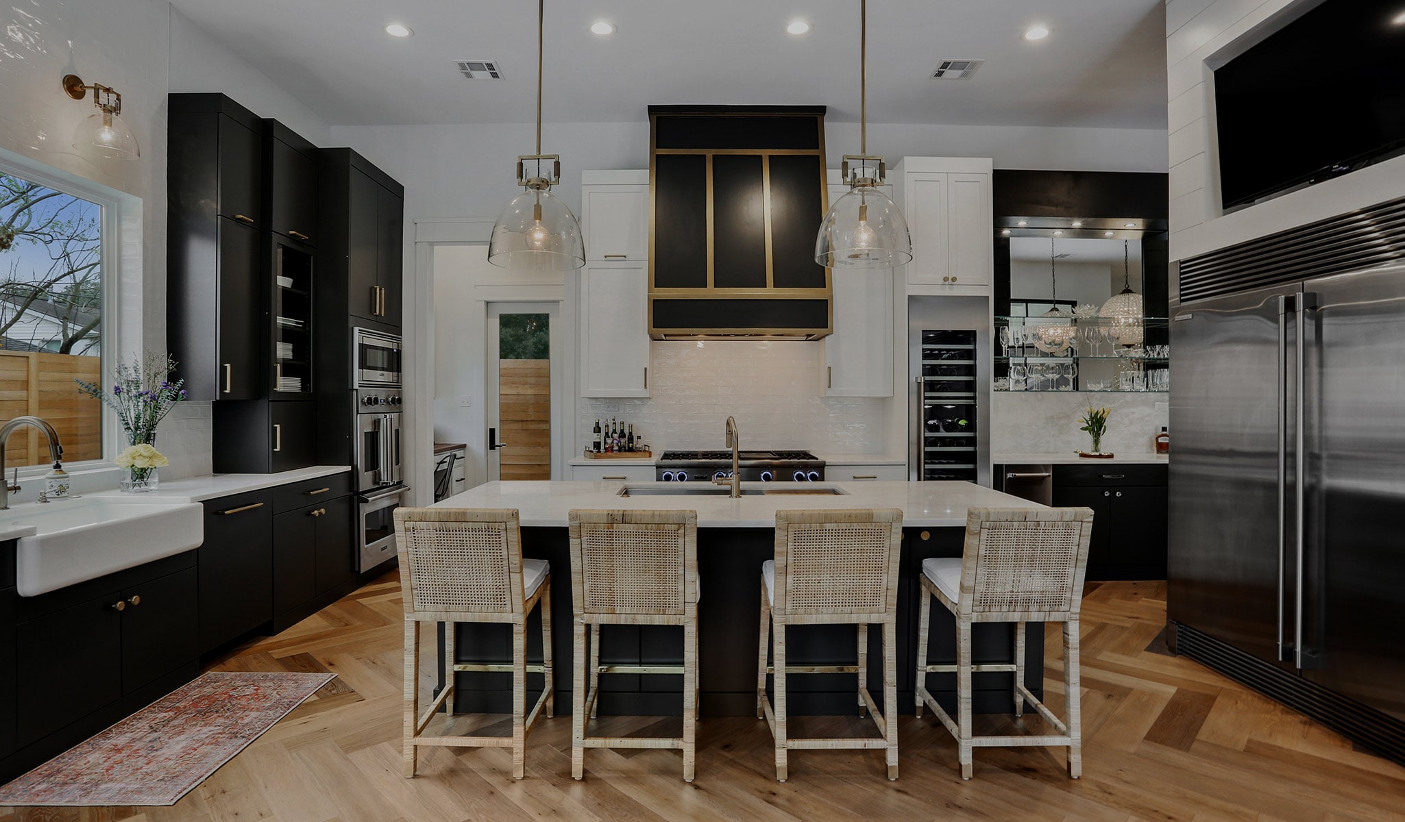 Painted shaker kitchen with an oversized island and pendant lighting