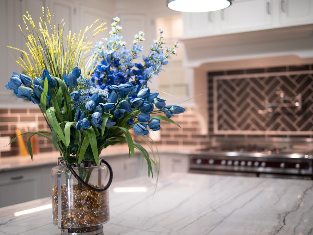 Renovated carriage house interior with custom cabinetry and timber detailing