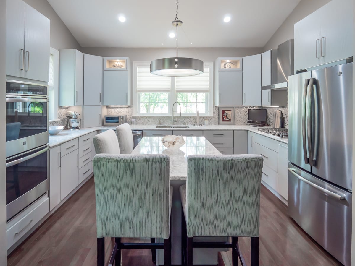 Bright remodelled kitchen with painted cabinetry and a central island